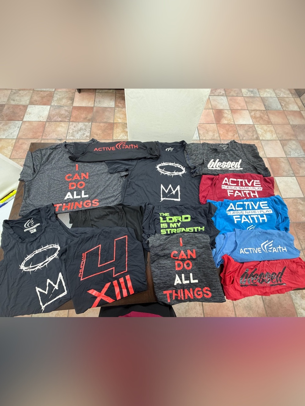 Two size medium tee shirts and eleven size medium tank tops